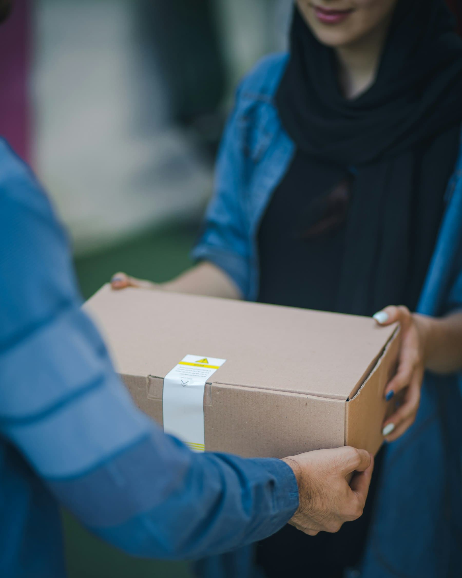 A parcel being handed to a customer